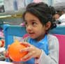 Peeling orange at Little Darling Childcare 