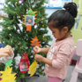 Little Dalrling Childcare decorating a Christmas tree